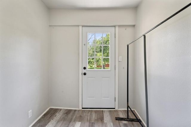 doorway to outside with hardwood / wood-style flooring