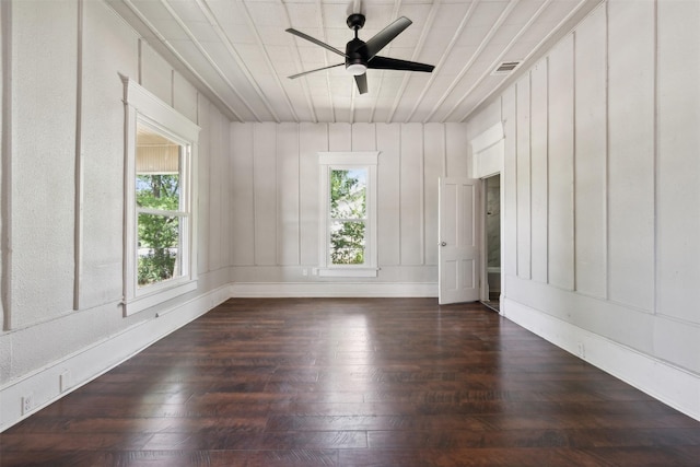 unfurnished room with dark hardwood / wood-style floors and ceiling fan