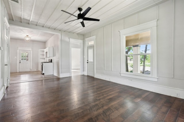 unfurnished living room with dark hardwood / wood-style floors and ceiling fan