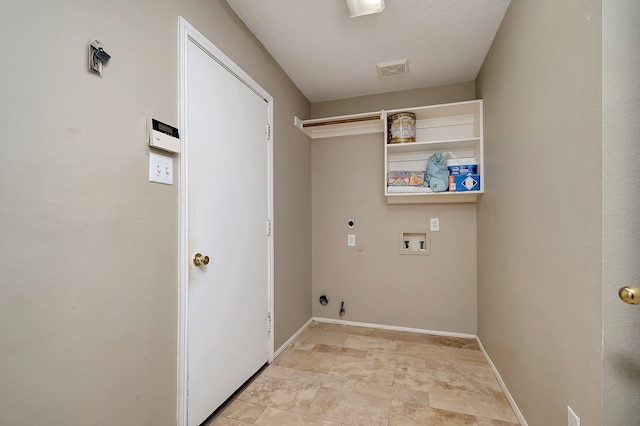 clothes washing area with electric dryer hookup, gas dryer hookup, and hookup for a washing machine