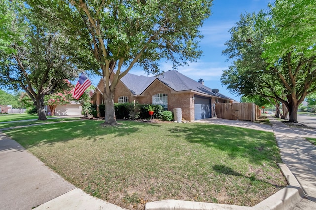 ranch-style house with a garage and a front yard