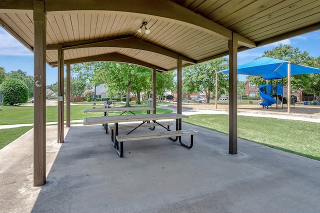 surrounding community with a playground and a lawn