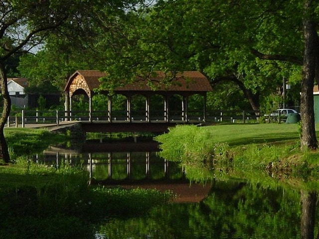 view of home's community featuring a gazebo and a water view