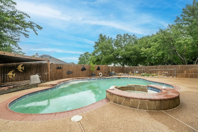 view of swimming pool featuring an in ground hot tub