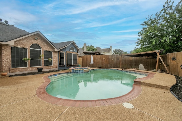 view of pool featuring a patio area and an in ground hot tub