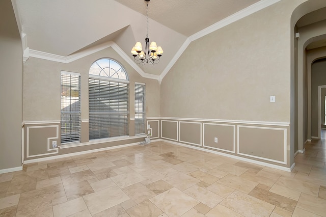 unfurnished room featuring ornamental molding, vaulted ceiling, and an inviting chandelier