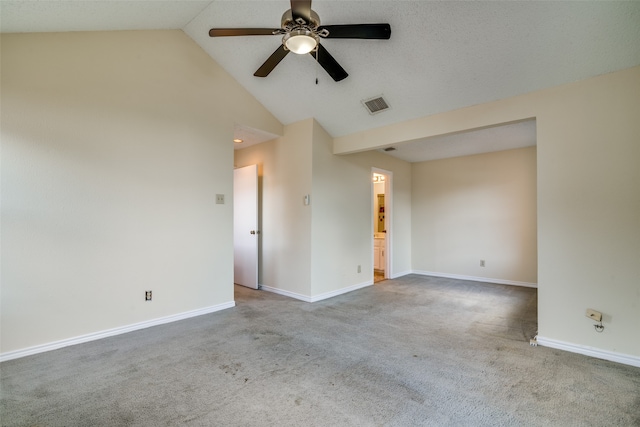 empty room featuring ceiling fan, carpet, and high vaulted ceiling