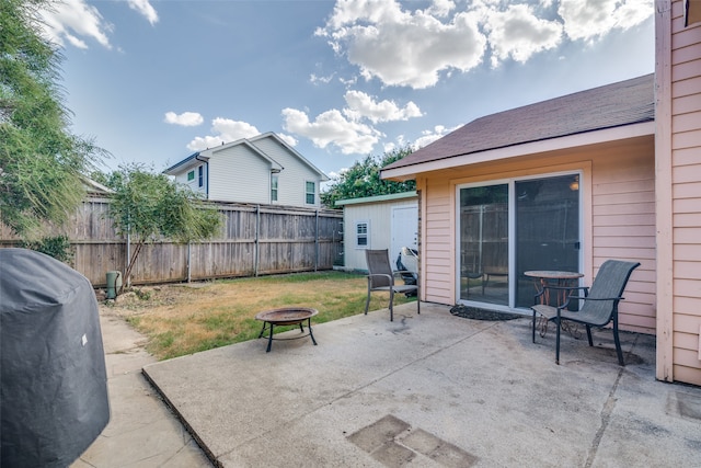 view of patio featuring grilling area and an outdoor fire pit