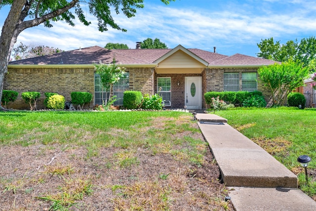 ranch-style house with a front lawn