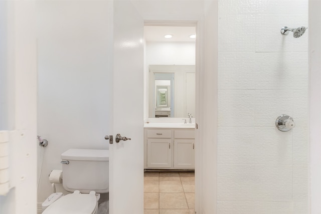 bathroom with vanity, tile patterned floors, and toilet