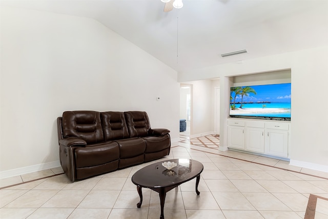 living room with light tile patterned flooring, ceiling fan, and vaulted ceiling