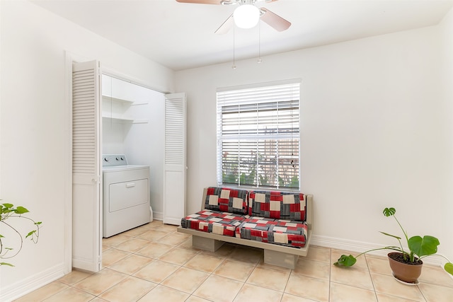 sitting room with washer / dryer, light tile patterned floors, and ceiling fan