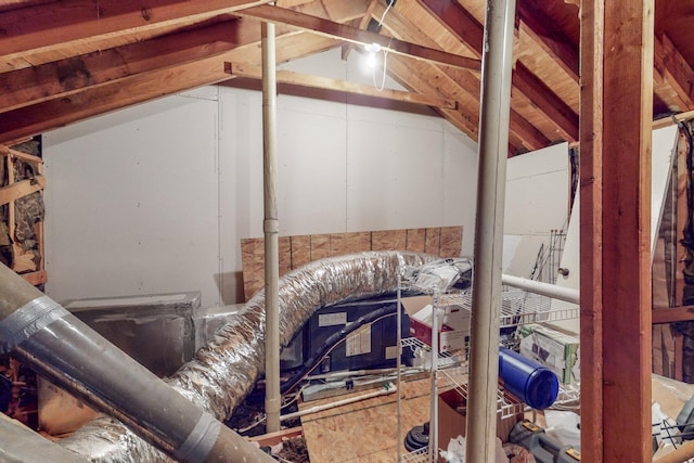 miscellaneous room with lofted ceiling with beams