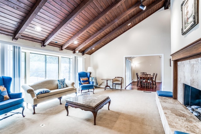 living room featuring wooden ceiling, high vaulted ceiling, carpet flooring, and beam ceiling