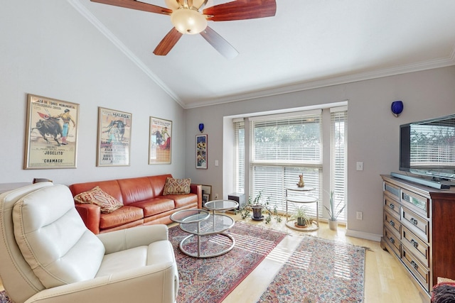 living room with ceiling fan, ornamental molding, light wood-type flooring, and vaulted ceiling