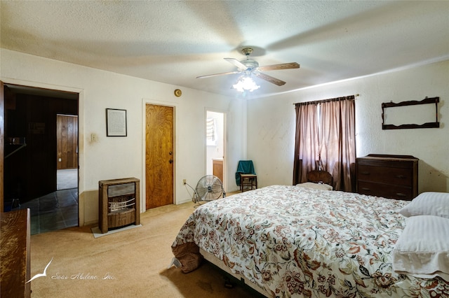 carpeted bedroom with a textured ceiling and ceiling fan