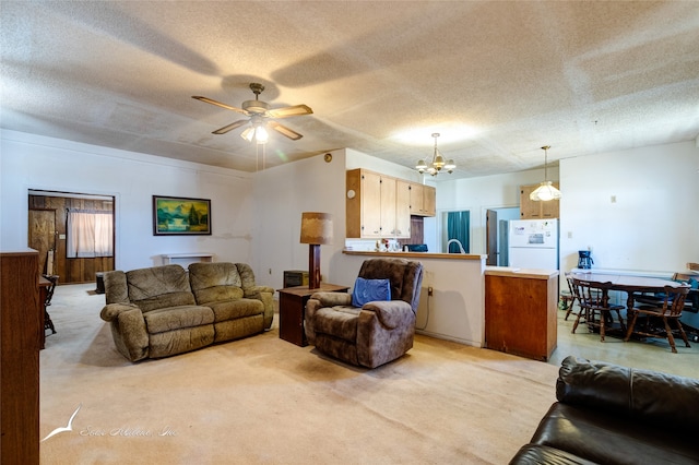 carpeted living room with a textured ceiling and ceiling fan