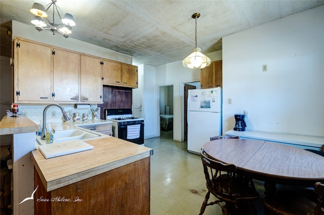 kitchen featuring white appliances, an inviting chandelier, backsplash, pendant lighting, and sink