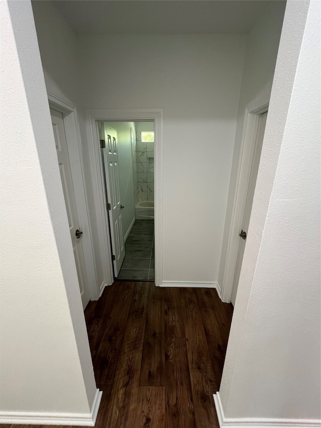 corridor featuring hardwood / wood-style floors