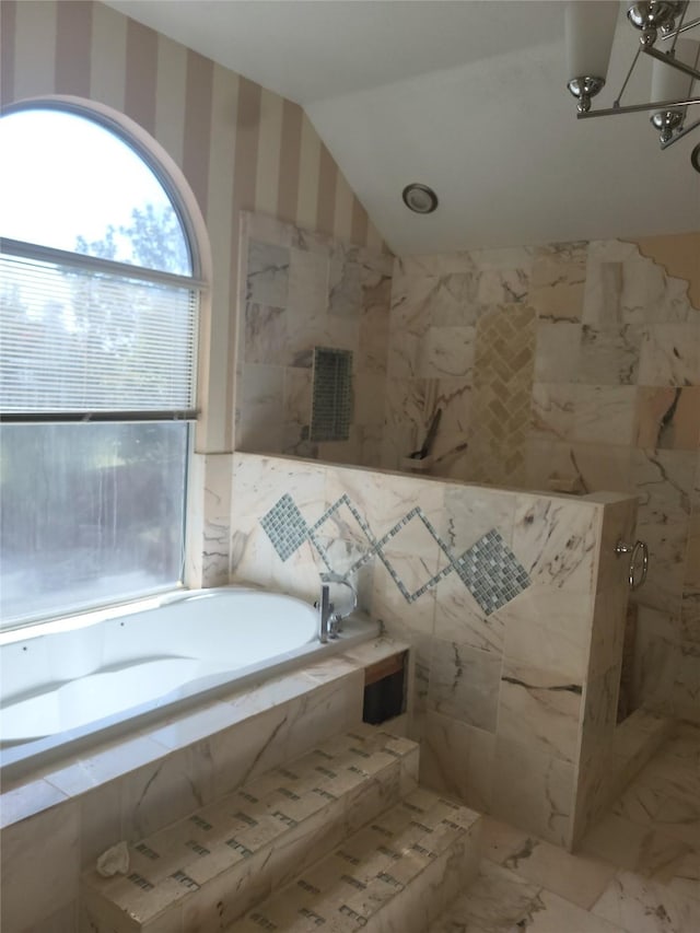 bathroom featuring separate shower and tub