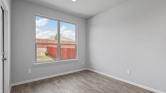 unfurnished room featuring wood-type flooring