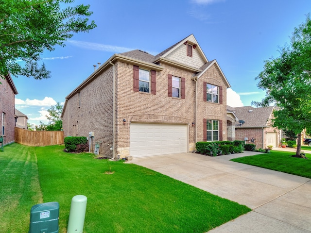 view of front of house featuring a garage and a front yard