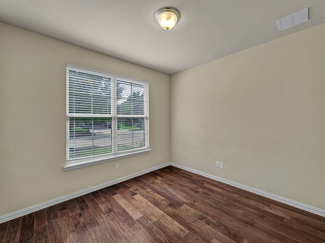 unfurnished room with wood-type flooring