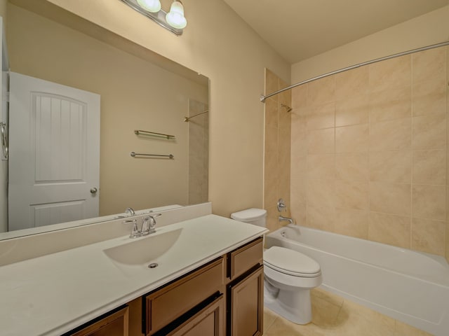 full bathroom with tile patterned floors, toilet, vanity, and tiled shower / bath