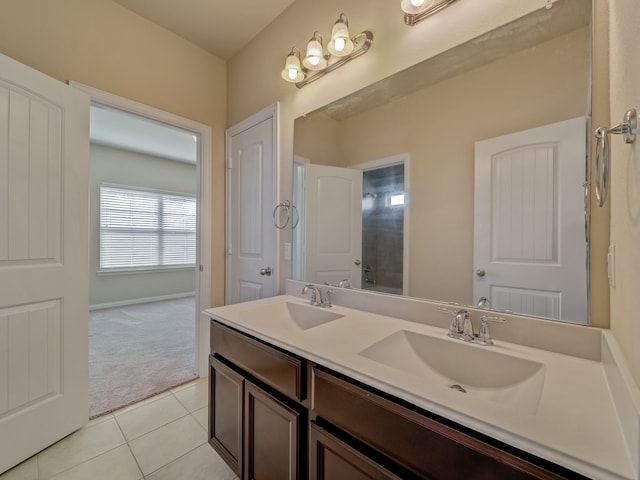 bathroom with double vanity and tile patterned floors