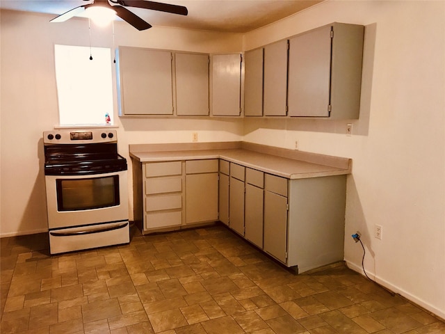 kitchen with ceiling fan and stainless steel range with electric stovetop