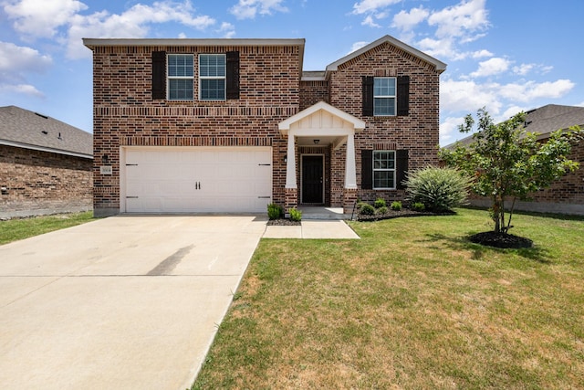 view of front facade with a front yard and a garage