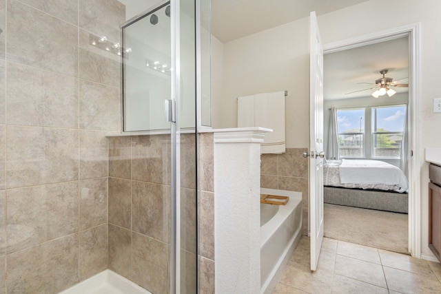 bathroom with vanity, tile patterned flooring, ceiling fan, separate shower and tub, and tile walls