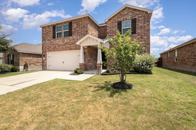 view of property featuring a garage and a front lawn