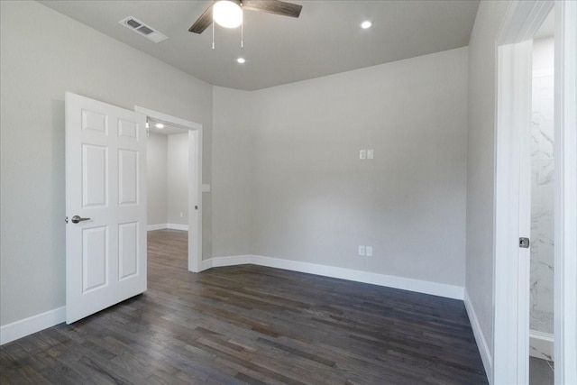 empty room featuring dark hardwood / wood-style floors and ceiling fan