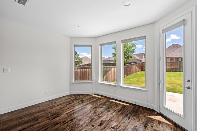 empty room with dark hardwood / wood-style floors