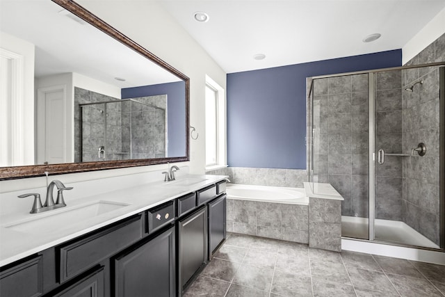 bathroom featuring tile patterned floors, vanity, and independent shower and bath