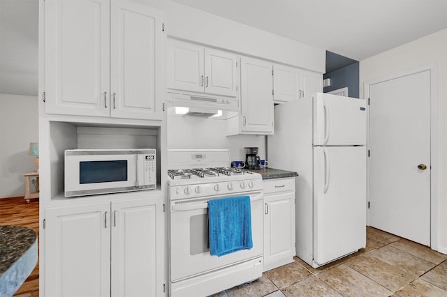 kitchen featuring white cabinetry and white appliances