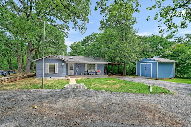 single story home with a front lawn and a storage unit