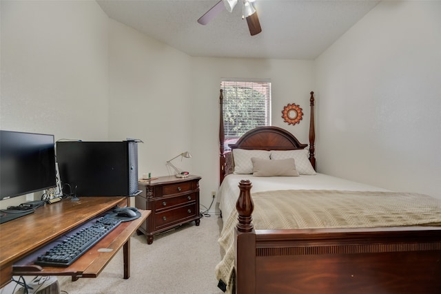 bedroom with light carpet and ceiling fan