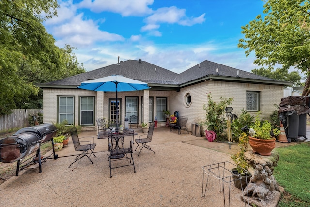 back of house with a patio