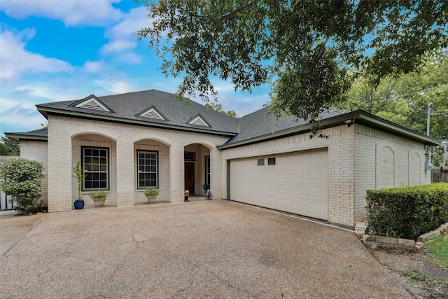 view of front of property with a garage