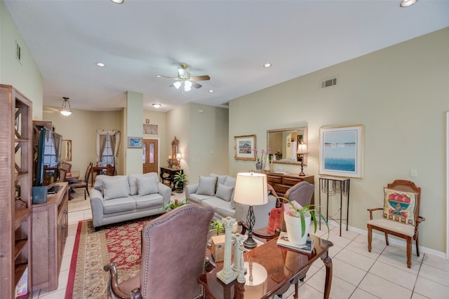 living room featuring light tile patterned floors and ceiling fan