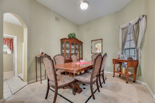 dining area with light tile patterned flooring