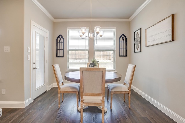 dining space featuring dark wood-type flooring, a notable chandelier, and ornamental molding