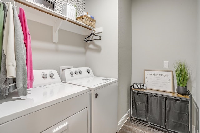 laundry room with independent washer and dryer and hardwood / wood-style floors