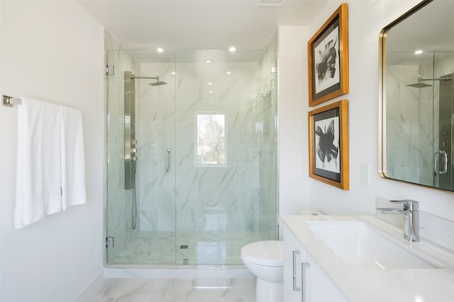 bathroom with vanity, an enclosed shower, tile patterned flooring, and toilet