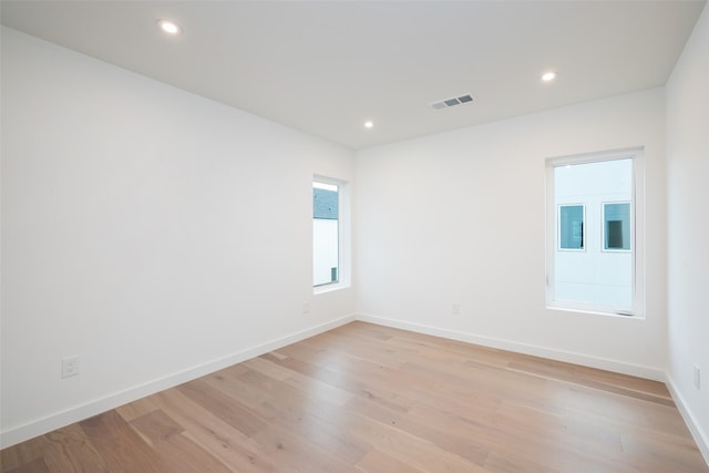 spare room with light hardwood / wood-style floors