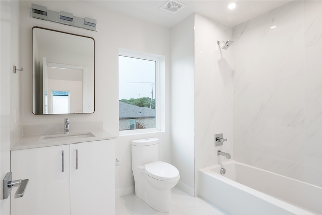 full bathroom featuring vanity, tiled shower / bath, tile patterned floors, and toilet