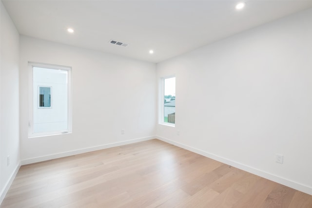 unfurnished room featuring light hardwood / wood-style flooring