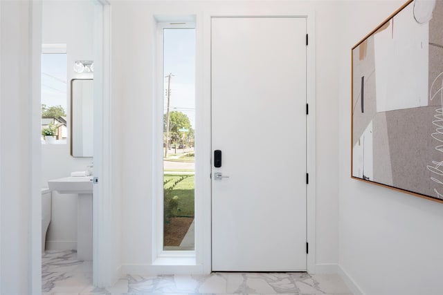 entryway with light tile patterned floors